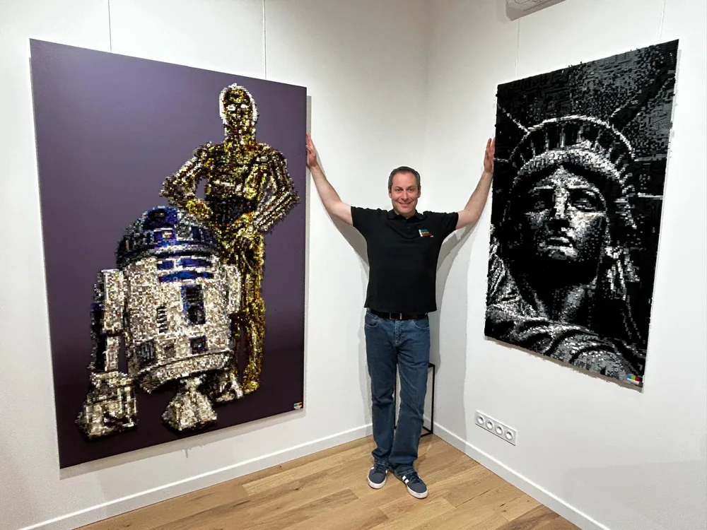 LEGO pixel artist Grégory posing with his creations