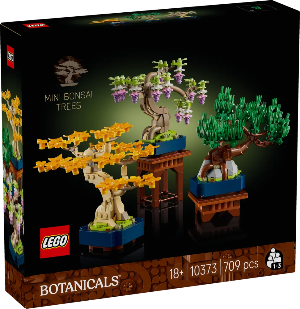Front of the LEGO Mini Bonsai Trees 10373 box, showcasing three different miniature trees in various styles: one with golden autumn leaves, one with lush green foliage, and one with delicate pink and purple blossoms. The box is dark with botanical-themed patterns.