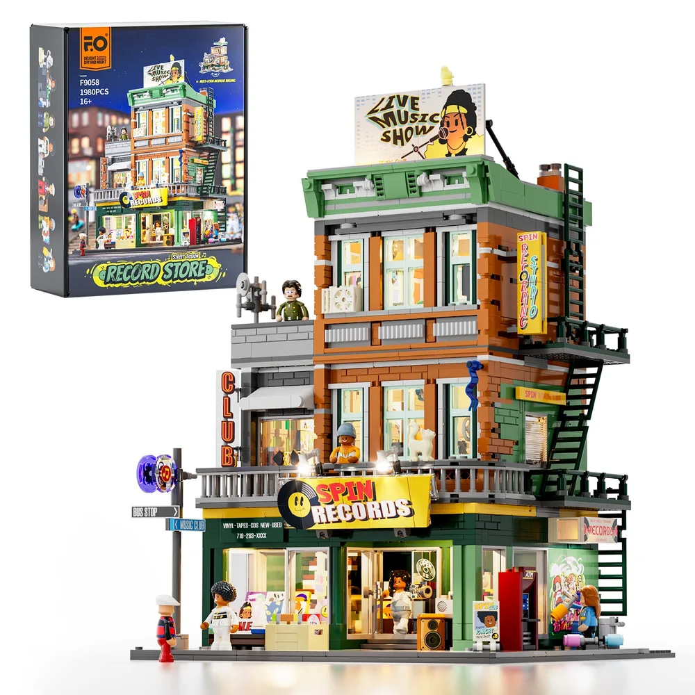 Full view of the Lumibricks F9058 Spin Records modular building kit with its box, showcasing multi-level architecture and illuminated signage.