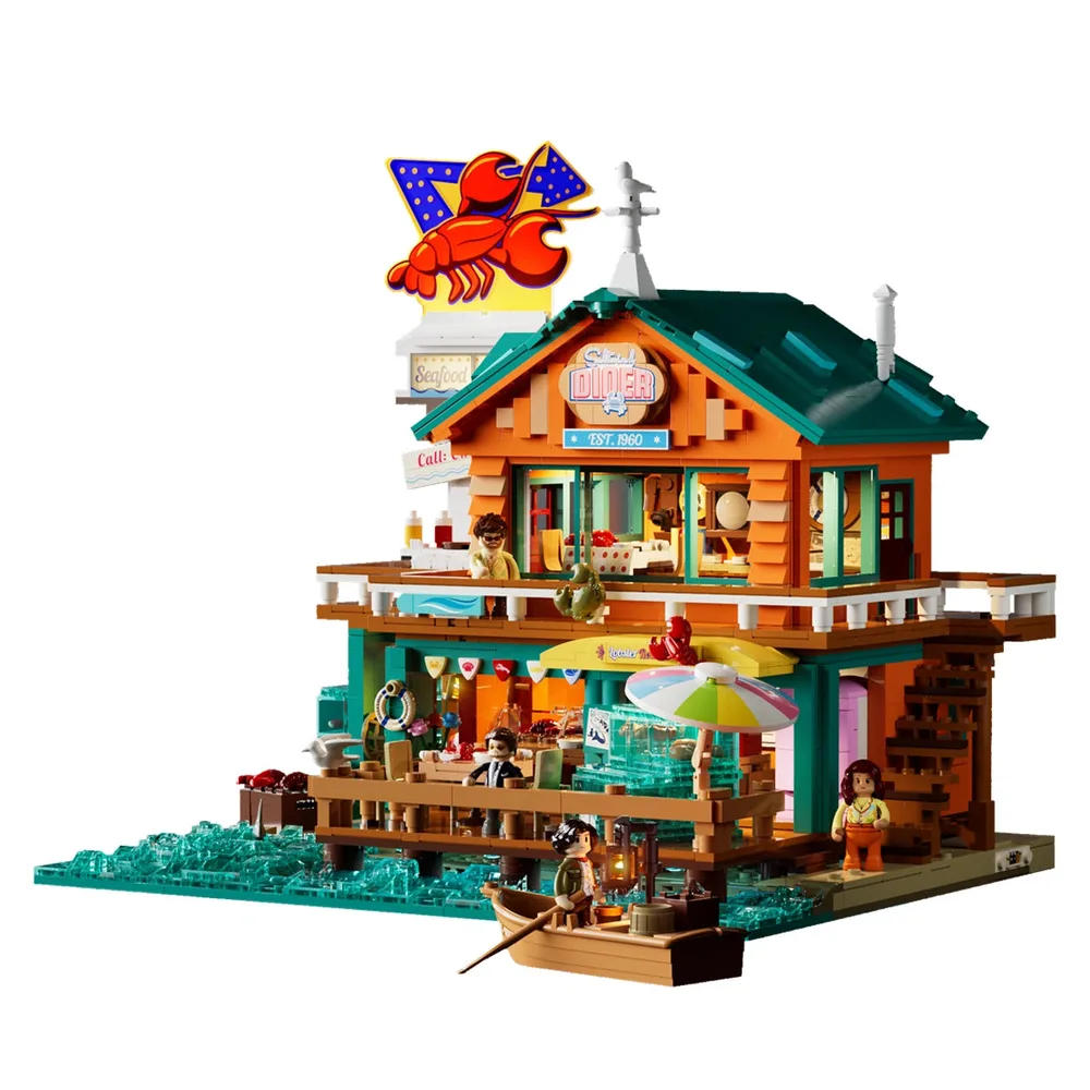 Lumibricks 18010 Seafood Restaurant, a vibrant two-story pier-side diner model with a large lobster sign, teal roof, and orange facade, showcasing detailed brickwork and integrated lighting for a coastal theme.