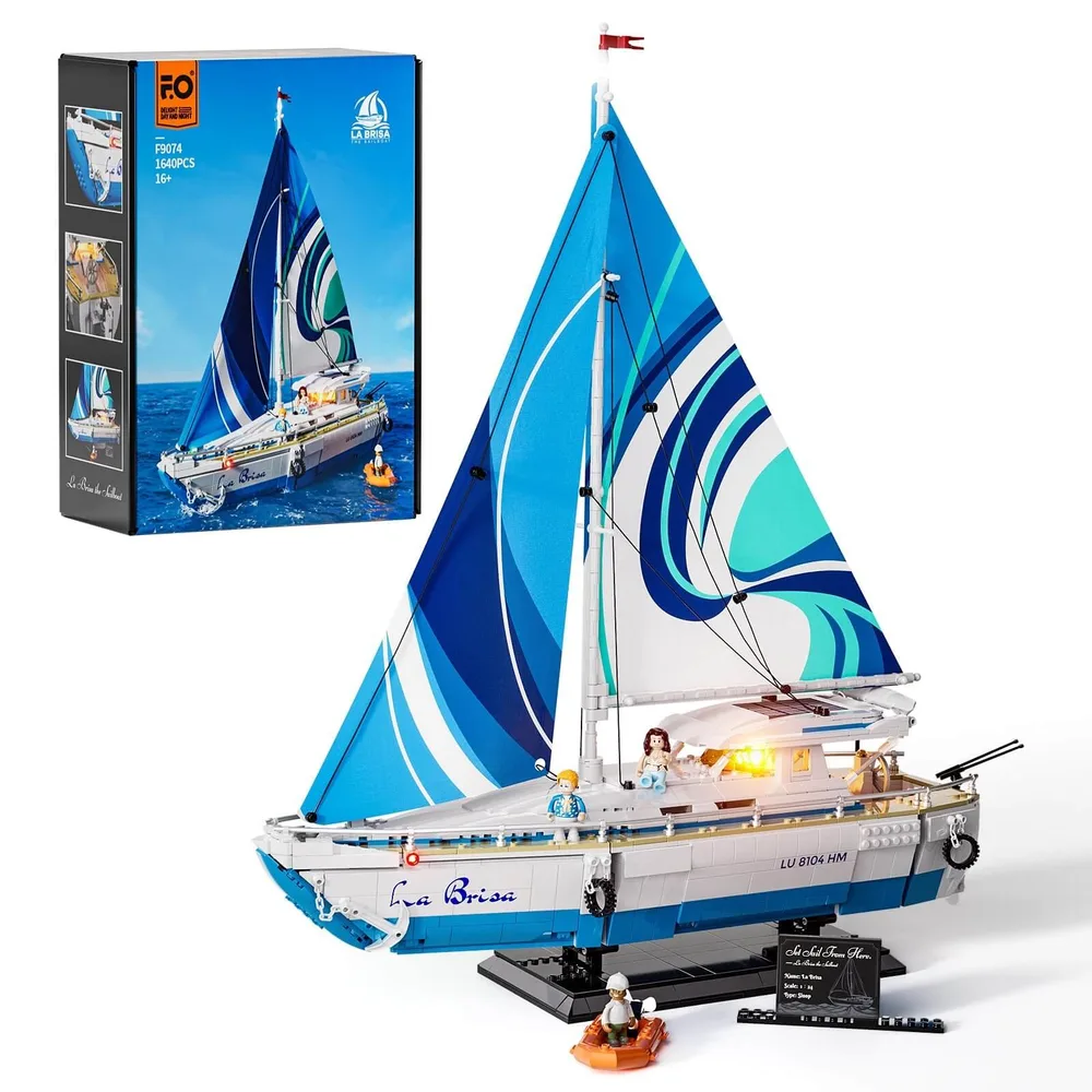 Lumibricks "La Brisa" sailboat model F9074 with its retail box in the background, showing the brand logo, set number, 1640 pieces, and age recommendation 14+. The model itself features blue and white sails, a white and blue hull, and minifigures on deck, with some lights visible.
