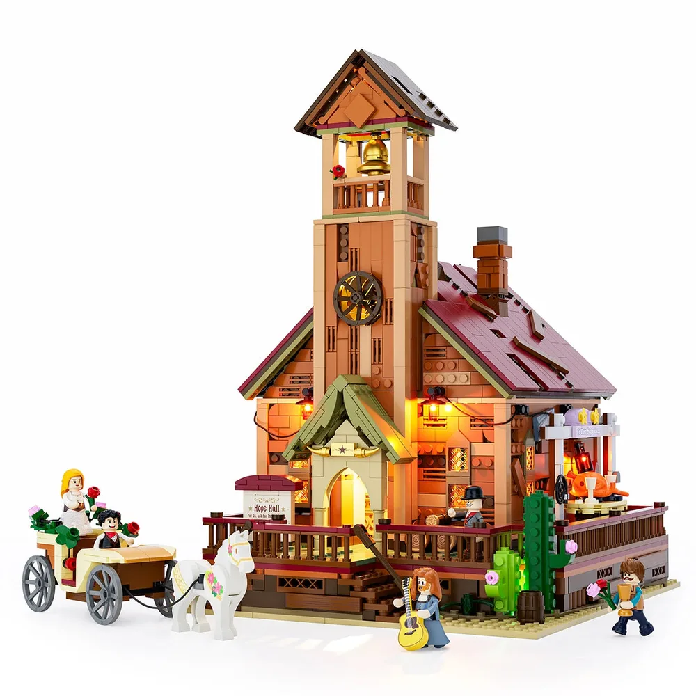 Front view of the Lumibricks Wild West Meeting Hall, illuminated, with minifigures and a horse-drawn carriage. The bell tower glows, and lanterns light the main entrance and deck.