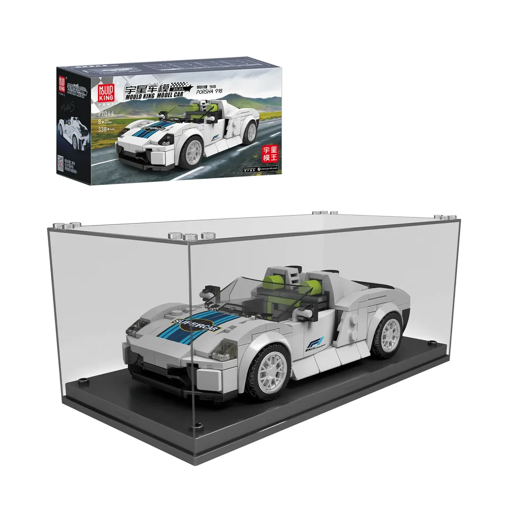 A white Mould King Porsha 918 brick-built car model with blue racing stripes and lime green interior sits within a clear acrylic display case with a black base. The original set box, featuring the same car on a scenic road, is positioned above and to the left of the display case.