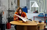 Man admiring Lego Concorde model.
