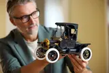 Man holding Lego Ford Model T 11376-1.