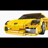 Front view of the yellow brick car model.