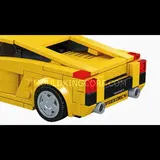 Rear view of the yellow brick car with exhaust details.