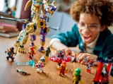 Close-up of hands playing with minifigures and the dragon.