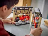 Hands joining the two LEGO set sections.