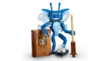 Pixie standing, holding quill.