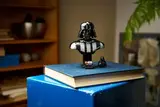 Darth Vader Bust on a book.