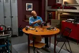 Person building LEGO Dodge Charger R/T
