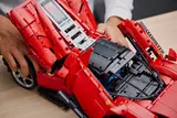 Hands opening the engine bay of the Lego Ferrari Daytona SP3.