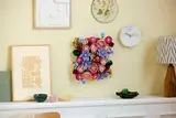 Square flower wall over mantel