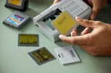 Inserting screen into Game Boy.