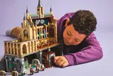 Child playing with combined Hogwarts Castle.