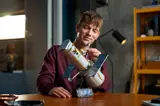 Builder admiring Hubble model.
