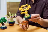 Placing LEGO Bonsai on stand.