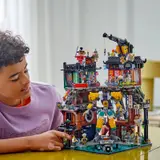 Person observing the LEGO Ninjago City Workshops.