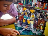 Person examining the mech within the set.