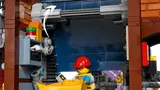 Minifigure at a garage door.