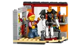 Minifigure in an art studio with a mech model.
