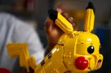 Adjusting Pikachu's ear.