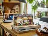 Overhead view of child building LEGO Privet Drive.