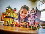 Child playing with set.