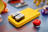 LEGO Smart Hub and Poké Ball close-up.