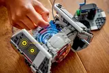 TIE Fighter connected to data/power base.