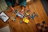 Overhead view of child playing with LEGO 75421 set.