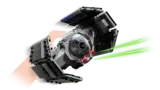 Hand flying TIE Fighter and firing.