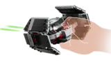 Hand holding TIE Fighter revealing smart brick slot.