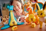 Child playing with LEGO Pokémon sets.