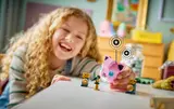 Girl playing with interactive Jigglypuff.