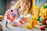 Girl playing with Jigglypuff and Smart Brick.