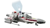 Hand placing R2-D2 into X-Wing's droid socket.