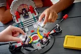 Hands placing Smart Bricks into LEGO 75427 set.