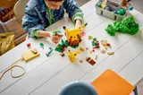 Child building LEGO Pikachu set.