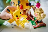 Child playing with Pikachu.