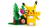Pikachu holding berry, glowing.