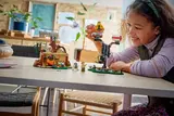 Girl playing with Lego 75422 set.