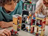 Child playing with Lego 76324.