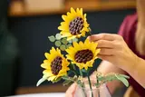Arranging LEGO sunflowers in a vase
