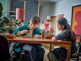 Kids playing with LEGO set.