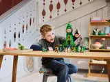 Boy playing with Lego Emerald City 75684.