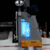 Close-up of illuminated 'CAUTION' beacon.