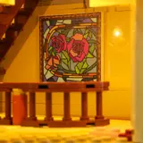 Illuminated interior rose art panel.