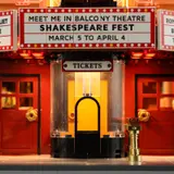 Illuminated theatre ticket booth entrance.